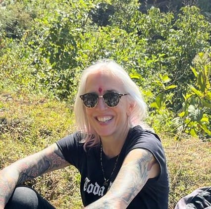 Maximiliana Women cheering on motorcycles in the mountains