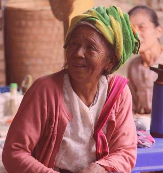 Burmese women Women cheering on motorcycles in the mountains