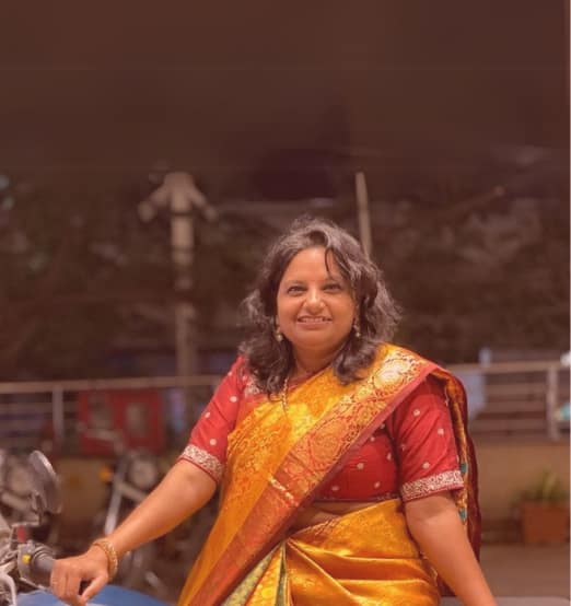 Jai Bharathi-4 Women cheering on motorcycles in the mountains