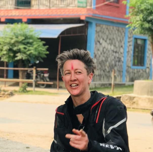 Ruth Women cheering on motorcycles in the mountains