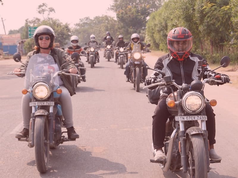 Wild adventure India Women cheering on motorcycles in the mountains