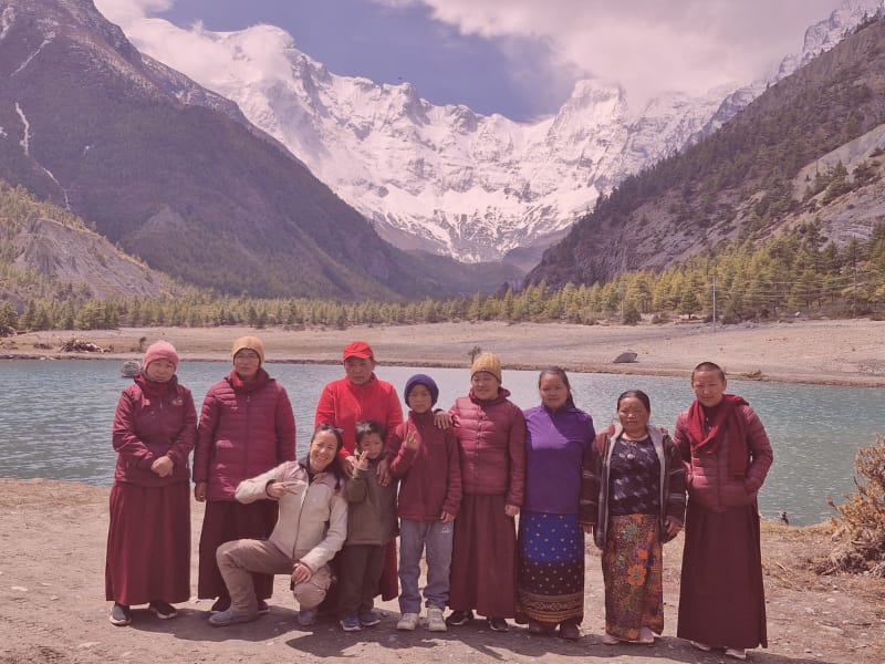 Sharing with Nepalese women Women cheering on motorcycles in the mountains